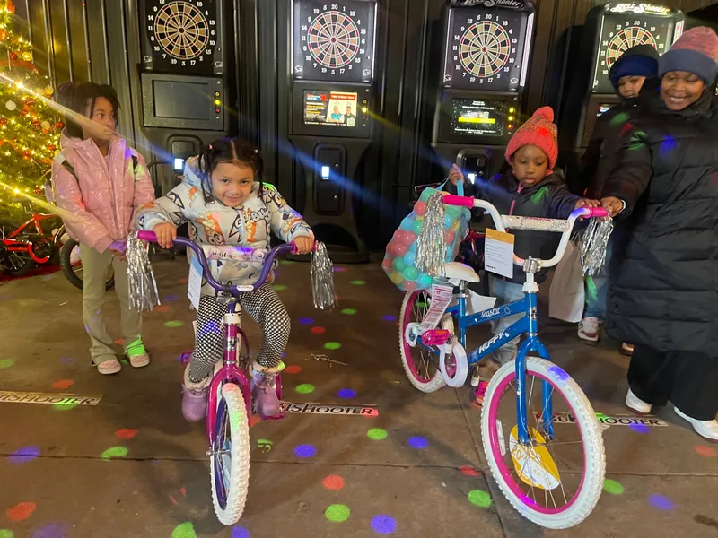Families celebrating together at Toys for Tots 2024