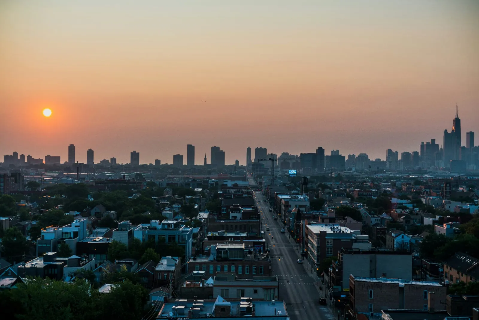 Chicago neighborhoods and downtown skyline at golden hour.